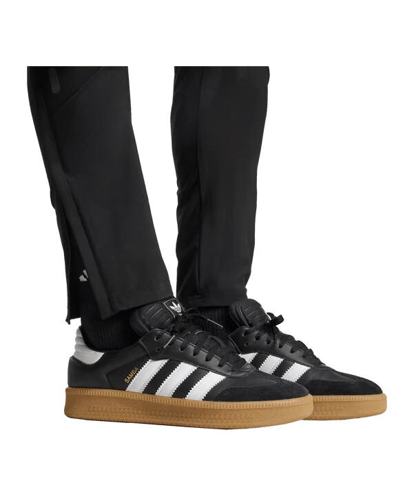 adidas manchester united vis tech travel hlače za trčanje crne