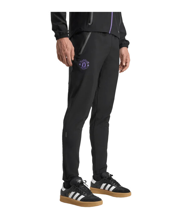 adidas manchester united vis tech travel hlače za trčanje crne